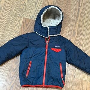 Like new Patagonia Navy Hooded Jacket with Red Accents reversible size 5t